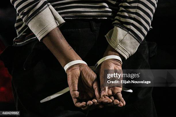 The hands of a black protester are seen following his arrest at a 'Millions March' demonstration protesting the killing of unarmed black men by...