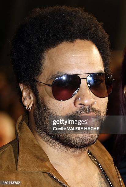 Singer and actor Lenny Kravitz poses while arriving at the Palais des Festivals to attend the 16th Annual NRJ Music Awards on December 13, 2014 in...