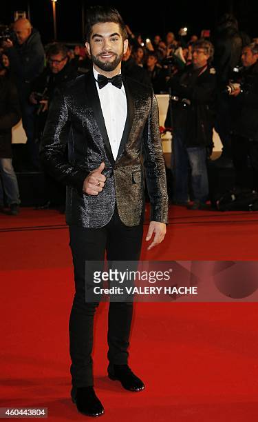 French singer Kendji Girac poses while arriving at the Palais des Festivals to attend the 16th Annual NRJ Music Awards on December 13, 2014 in...