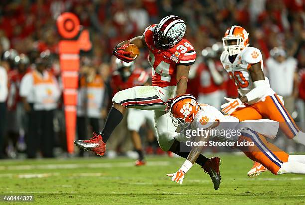 Carlos Hyde of the Ohio State Buckeyes runs with the ball in the third quarter against the Clemson Tigers during the Discover Orange Bowl at Sun Life...