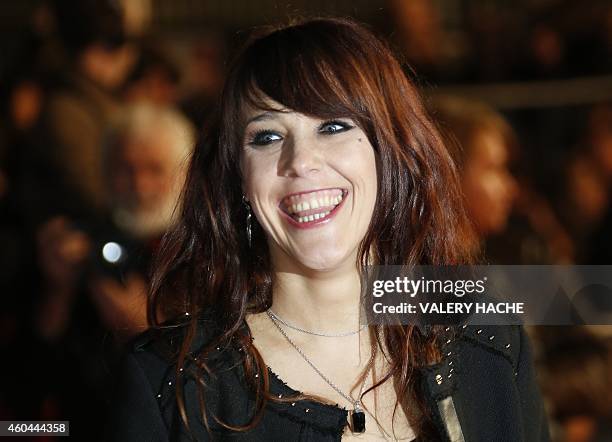 French singer Zaz smiles while arriving at the Palais des Festivals to attend the 16th Annual NRJ Music Awards on December 13, 2014 in Cannes,...