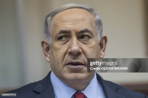 Israeli Prime Minister Benjamin Netanyahu chairs the weekly cabinet meeting in his Jerusalem offices on December 14, 2014. Parliament set polling day...