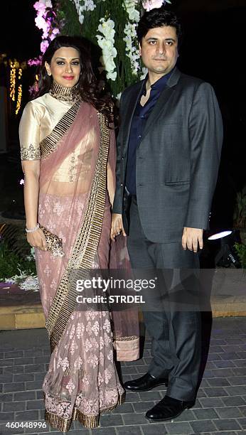 Indian Bollywood actress Sonali Bendre with her husband director Goldie Bahl attends the marriage Sangeet ceremony of Bollywood film director Punit...