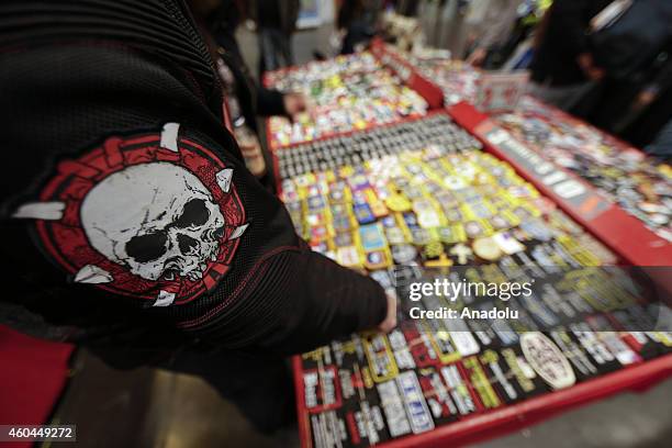 Visitors check out various motorcycle stickers produced by a Turkish brand 'Patchstop' are seen during the Progressive International Motorcycle Show...