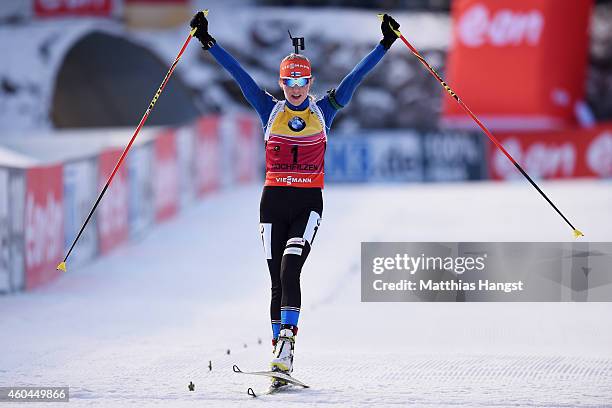 Kaisa Makarainen of Finland celebrates at the finish winning the women's 10 km pursuit event during the IBU Biathlon World Cup on December 14, 2014...