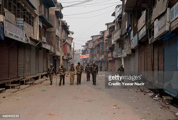 Indian government patrol the streets after rock throwing protests by Kashmir protesters, during the fourth phase of assembly elections on December...