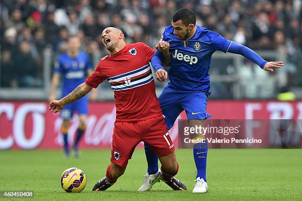 Carlos Tevez of Juventus FC tackles Angelo Palombo of UC Sampdoria during the Serie A match between Juventus FC and UC Sampdoria at Juventus Arena on...