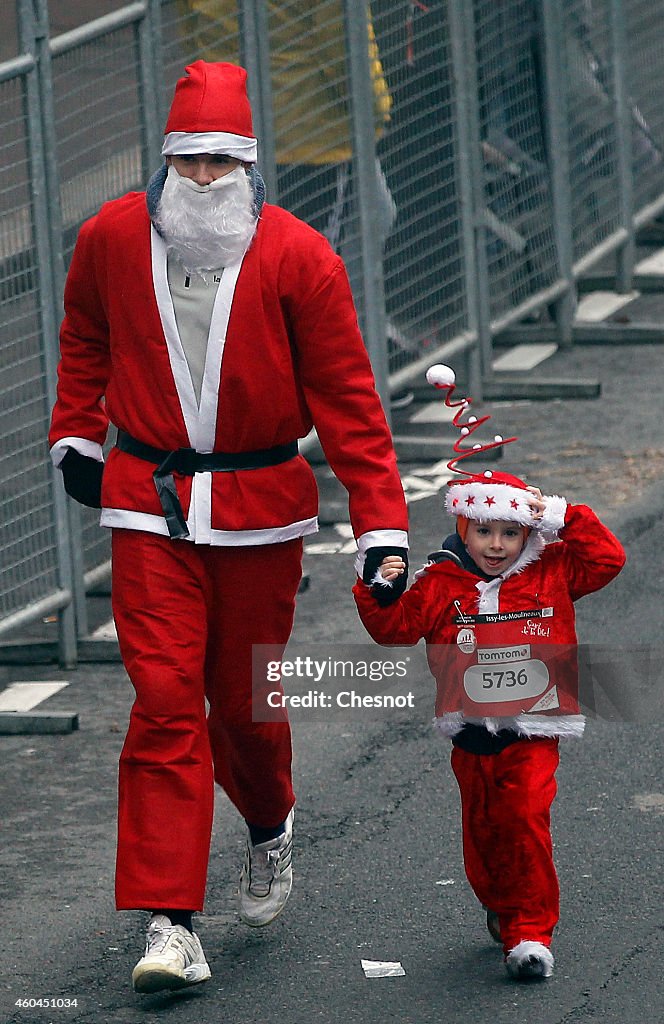 Thousands Of Runners Dressed In Santa Claus Outfits At The Annual Christmas Corrida At Issy-les-Moulineaux