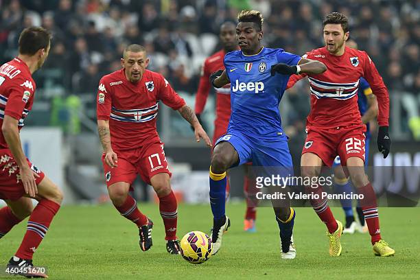 Paul Pogba of Juventus FC in action against Angelo Palombo and Luca Rizzo of UC Sampdoria during the Serie A match between Juventus FC and UC...