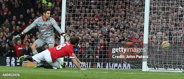 Juan Mata of Manchester United scores their second goal during the Barclays Premier League match between Manchester United and Liverpool at Old...