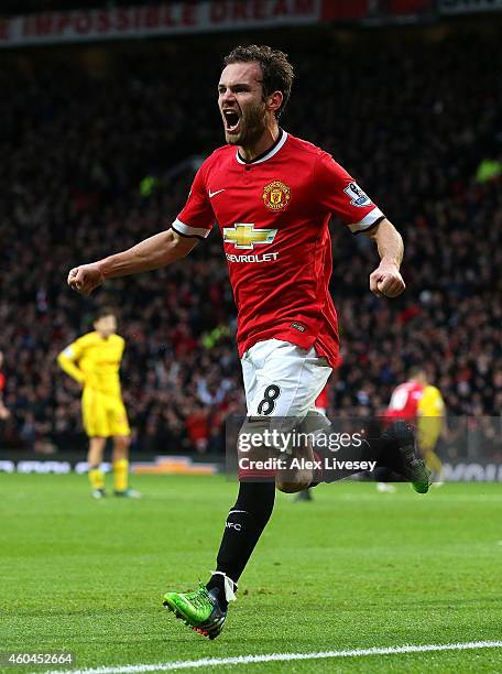 Juan Mata of Manchester United celebrates scoring the second goal during the Barclays Premier League match between Manchester United and Liverpool at...