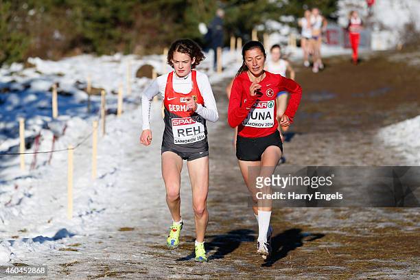 Emine Hatun Tuna of Turkey and Alina Reh of Germany lead the Junior Women's Race during the European Cross-Country Championships on December 14, 2014...