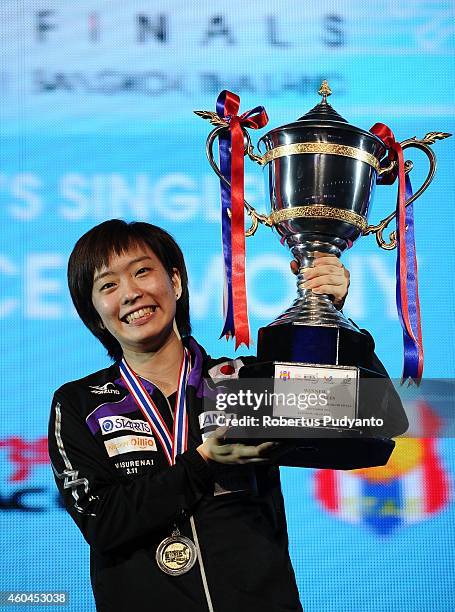 Winner Kasumi Ishikawa of Japan poses with the trophy on the podium during the awarding ceremony of the 2014 ITTF World Tour Grand Finals at Huamark...