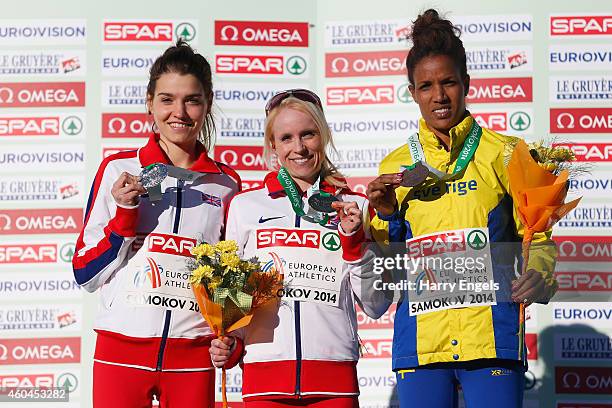 Kate Avery of Great Britain , Gemma Steel of Great Britain and Meraf Bahta of Sweden pose with their medals following the Senior Women's Race during...