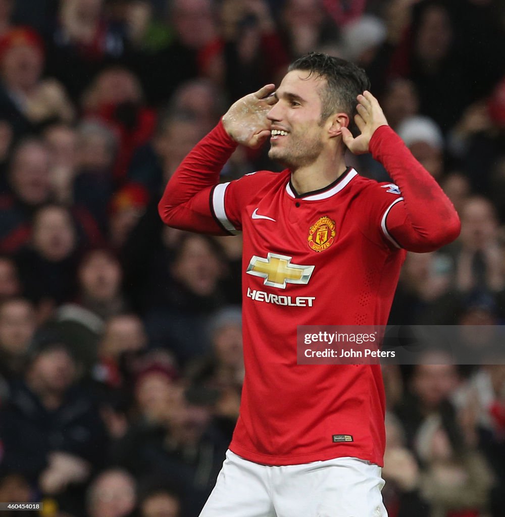 Robin van Persie of Manchester United celebrates scoring their third