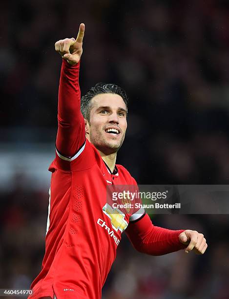 Robin van Persie of Manchester United celebrates scoring the third goal during the Barclays Premier League match between Manchester United and...