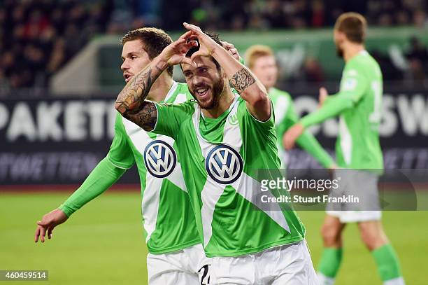 Vierinha and Sebastian Jung of Wolfsburg celebrate an own goal by Rafa of Paderborn during the Bundesliga match between VfL Wolfsburg and SC...