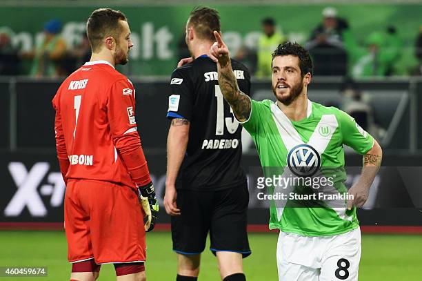Vierinha of Wolfsburg celebrates as Christian Strohdiek and goalkeeper Lukas Kruse of Paderborn react following an own goal by Rafa of Paderborn...