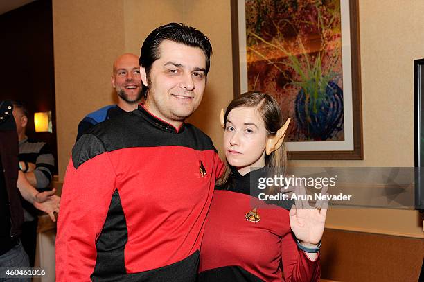 Guests pose in Star Trek costumes at the Creation Entertainment's Official Star Trek Convention at Hyatt Regency San Francisco Airport on December...