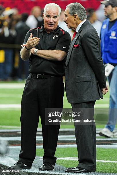 Head coach Mike Smith of the Atlanta Falcons talks to Arthur Blank, the team owner, prior to the game against the Pittsburgh Steelers at the Georgia...