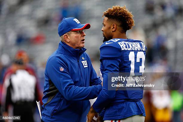 Head coach Tom Coughlin of the New York Giants talks with Odell Beckham Jr. #13 on the field during warm-ups prior to their game against the...