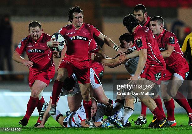 Rhodri Williams of Scarlets makes a break during the European Rugby Champions Cup match between Scarlets and Ulster Rugby at Parc y Scarlets on...