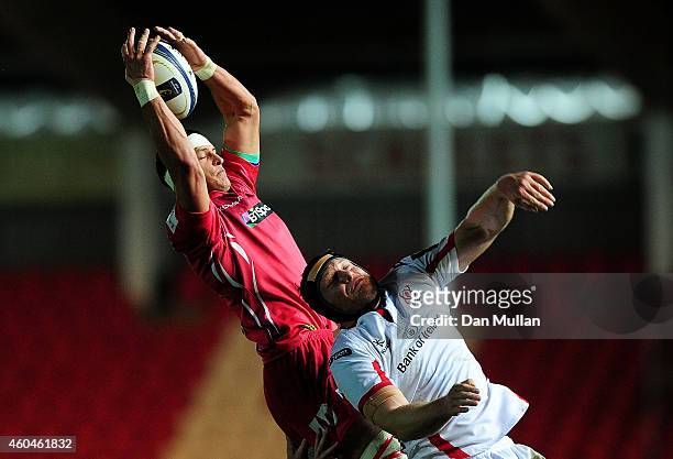 Aaron Shingler of Scarlets rises above Franco van der Merwe of Ulster at the line out during the European Rugby Champions Cup match between Scarlets...