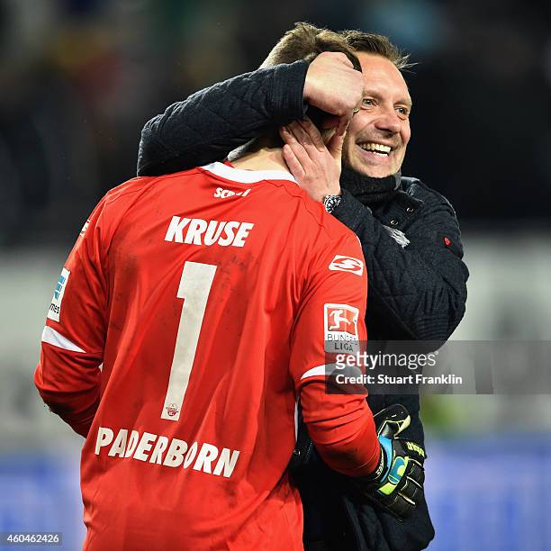 Head coach Andre Breitenreiter of Paderborn hugs goalkeeper Lukas Kruse after the Bundesliga match between VfL Wolfsburg and SC Paderborn 07 at...