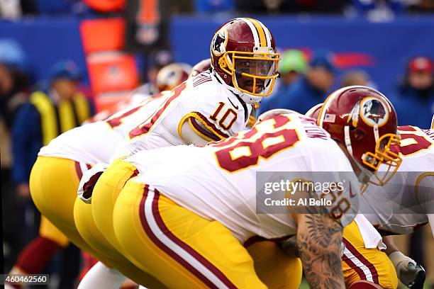 Robert Griffin III of the Washington Redskins calls a play in the first quarter against the New York Giants during their game at MetLife Stadium on...