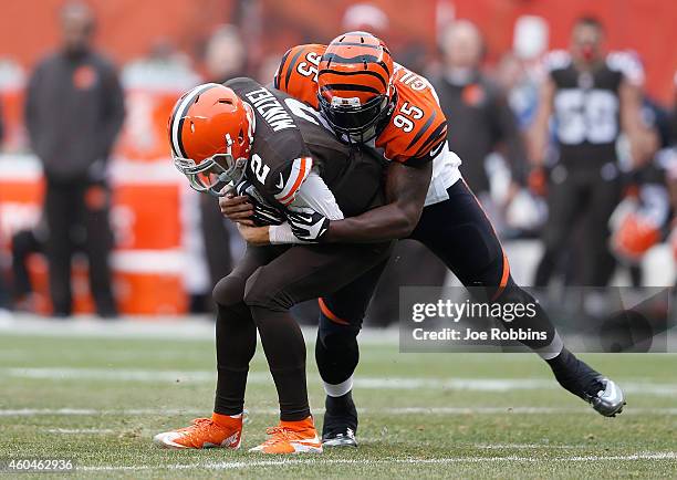 Wallace Gilberry of the Cincinnati Bengals sacks Johnny Manziel of the Cleveland Browns during the first quarter at FirstEnergy Stadium on December...