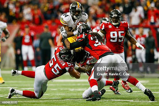 Antonio Brown of the Pittsburgh Steelers is tackled by Paul Worrilow, Kemal Ishmael and Dezmen Southward of the Atlanta Falcons after a reception in...