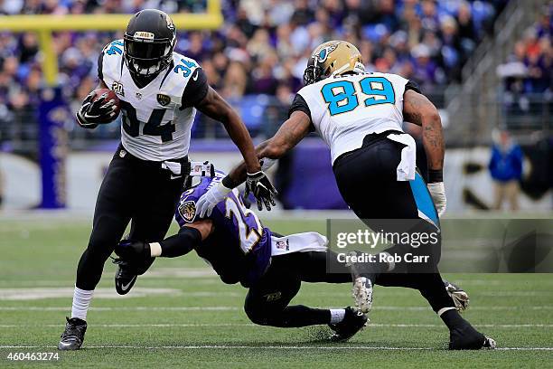 Running back Storm Johnson of the Jacksonville Jaguars sheds the tackle of cornerback Asa Jackson of the Baltimore Ravens in the first quarter at M&T...