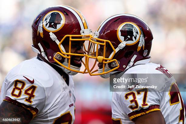 Chris Thompson of the Washington Redskins celebrates with Niles Paul after scoring a 9 yard touchdown in the second quarter against the New York...