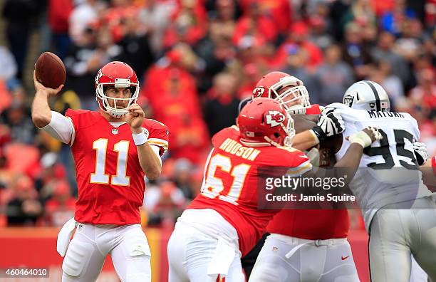 Alex Smith of the Kansas City Chiefs passes against the Oakland Raiders during the first half at Arrowhead Stadium on December 14, 2014 in Kansas...