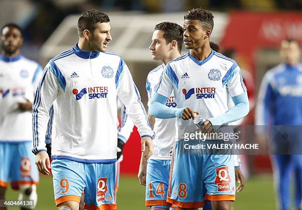 Marseille's French forward Andre-Pierre Gignac speaks to Marseille's French midfielder Mario Lemina before the French L1 football match Monaco vs...