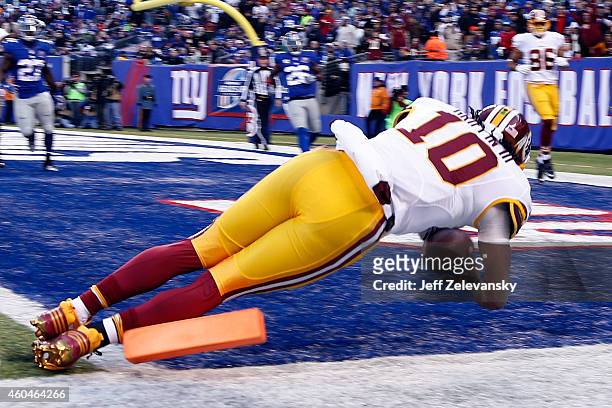 Robert Griffin III of the Washington Redskins fumbles the ball out of bounds in End Zone in the second quarter against the New York Giants during...