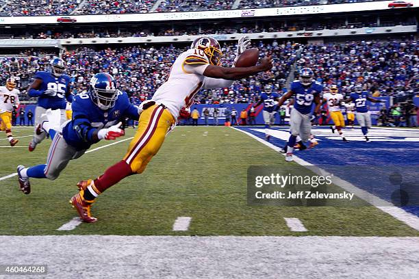 Robert Griffin III of the Washington Redskins fumbles the ball out of bounds in End Zone in the second quarter against the New York Giants during...