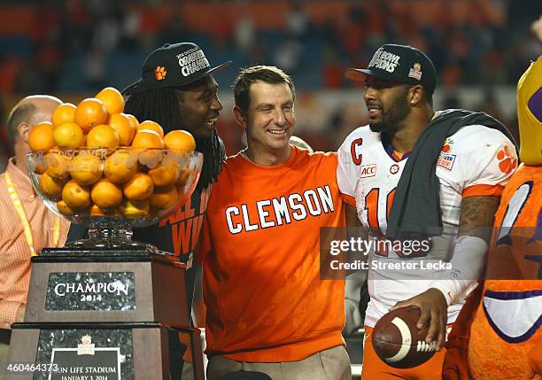 Sammy Watkins, head coach Dabo Swinney and Tajh Boyd of the Clemson Tigers celebrate after defeating the Ohio State Buckeyes during the Discover...