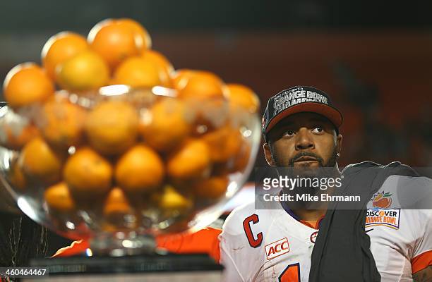 Tajh Boyd of the Clemson Tigers looks on from the trophy podium after defeating the Ohio State Buckeyes during the Discover Orange Bowl at Sun Life...