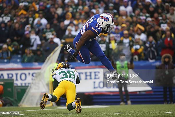 Bryce Brown of the Buffalo Bills breaks the tackle by Tramon Williams of the Green Bay Packers during the second half at Ralph Wilson Stadium on...