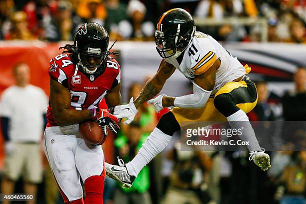 Roddy White of the Atlanta Falcons catches a touchdown pass over Antwon Blake of the Pittsburgh Steelers in the second half at the Georgia Dome on...