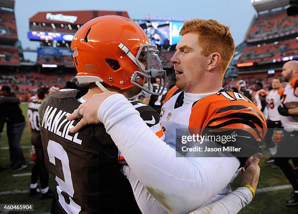 Johnny Manziel of the Cleveland Browns talks with Andy Dalton of the Cincinnati Bengals after Cincinnati's 30-0 win at FirstEnergy Stadium on...