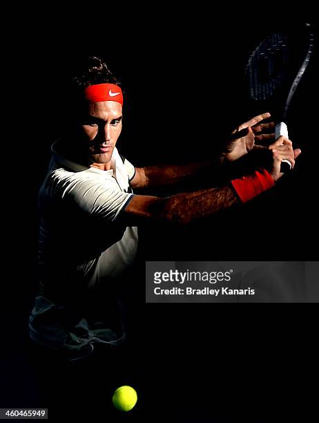 Roger Federer of Switzerland plays a backhand in his semi final match against Jeremy Chardy of France during day seven of the 2014 Brisbane...