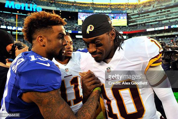 Odell Beckham Jr. #13 of the New York Giants shakes hands with Robert Griffin III of the Washington Redskins after their game at MetLife Stadium on...