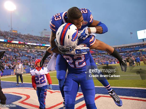 Aaron Williams of the Buffalo Bills jumps on the back of Fred Jackson of the Buffalo Bills celebrating the win over the Green Bay Packers at Ralph...