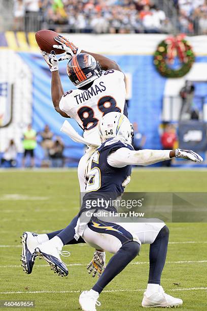 Wide receiver Demaryius Thomas of the Denver Broncos catches a 28-yard touchdown pass while defended by cornerback Brandon Flowers of the San Diego...