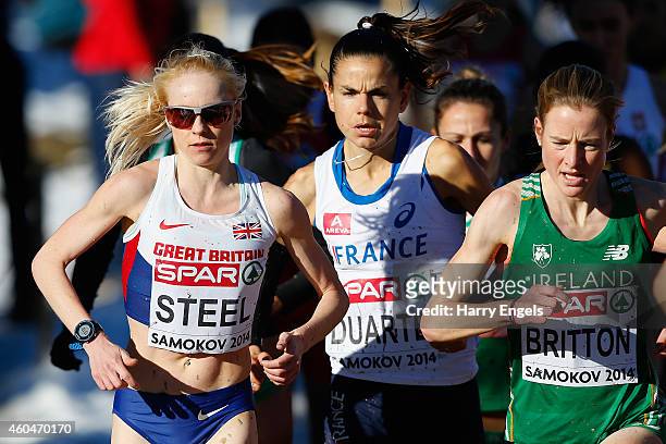 Gemma Steel of Great Britain , Sophie Duarte of France and Fionnuala Britton of Ireland run during the Senior Women's Race during the European...