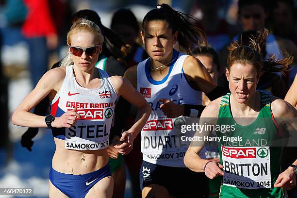 Gemma Steel of Great Britain , Sophie Duarte of France and Fionnuala Britton of Ireland run during the Senior Women's Race during the European...