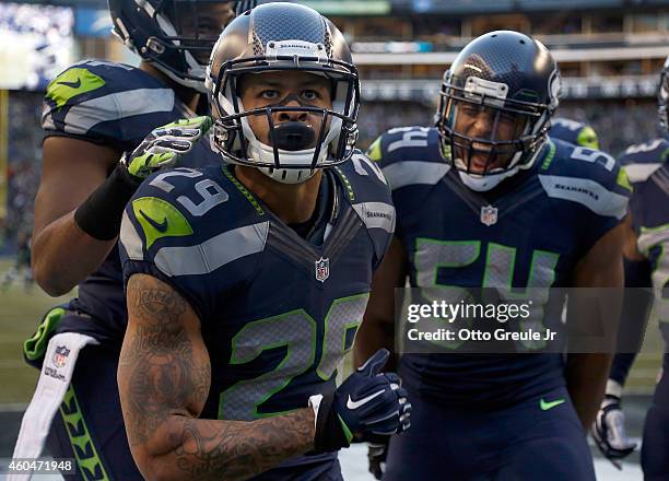 Free safety Earl Thomas of the Seattle Seahawks celebrates with middle linebacker Bobby Wagner of the Seattle Seahawks after Thomas made a play on a...