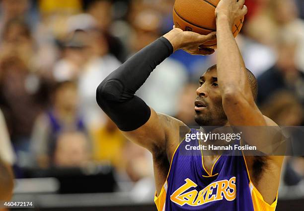 Kobe Bryant of the Los Angeles Lakers shoots a free throw to tie Michael Jordan on the all-time scoring list during the second quarter of the game...